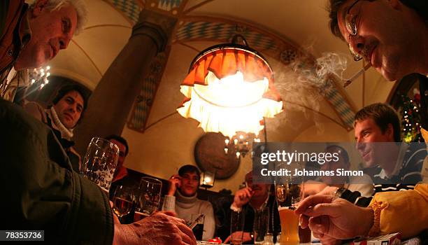 Convinced cigarette smokers wait for the start of a smokers protest rally at Loewenbraeu Keller beer hall on December 10, 2007 in Munich, Germany. A...