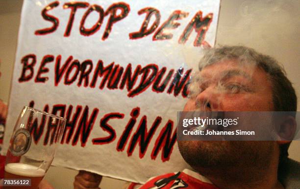 Convinced cigarette smokers attends a smokers protest rally at Loewenbraeu Keller beer hall on December 10, 2007 in Munich, Germany. A coalition of...