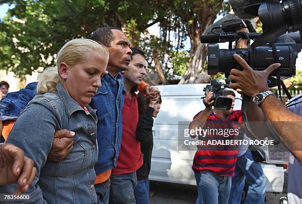 Group of anti-Castro Cuban activists, lead by Darsy Ferrer , are filmed by journalists as they stage a protest through the streets of Havana to mark...