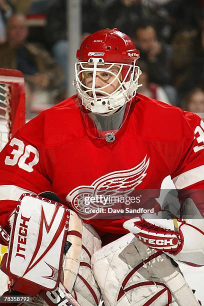 Chris Osgood of the Detroit Red Wings protects the goal during the NHL game against Tampa Bay Lightning at the Joe Louis Arena on November 29, 2007...