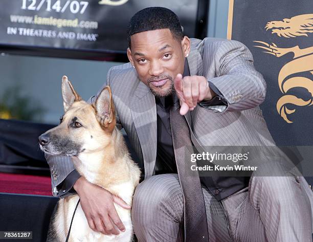 Actor Will Smith poses with Abby, the dog from "I Am Legend" as he is honored with a hand and footprint ceremony at Grauman's Chinese Theatre...