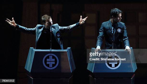 Gary Barlow and Jason Orange of Take That perform at Manchester Arena on December 10, 2007 in Manchester, England.