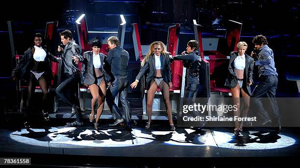 Gary Barlow, Mark Owen, Jason Orange and Howard Donald of Take That perform at Manchester Arena on December 10, 2007 in Manchester, England.