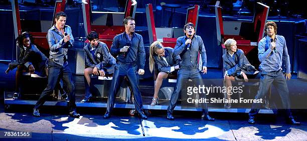 Gary Barlow, Mark Owen, Jason Orange and Howard Donald of Take That perform at Manchester Arena on December 10, 2007 in Manchester, England.
