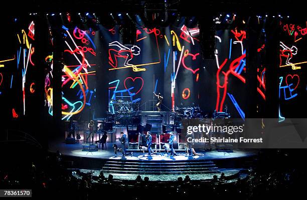 Gary Barlow, Mark Owen, Jason Orange and Howard Donald of Take That perform at Manchester Arena on December 10, 2007 in Manchester, England.