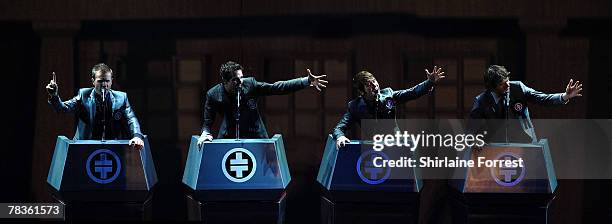 Gary Barlow, Mark Owen, Jason Orange and Howard Donald of Take That perform at Manchester Arena on December 10, 2007 in Manchester, England.