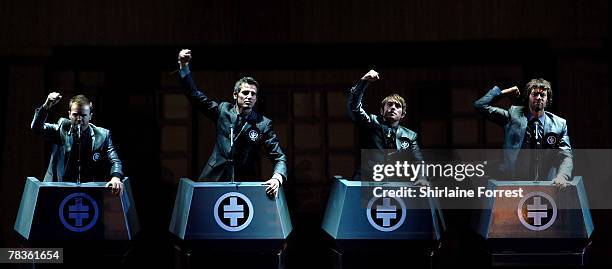 Gary Barlow, Mark Owen, Jason Orange and Howard Donald of Take That perform at Manchester Arena on December 10, 2007 in Manchester, England.