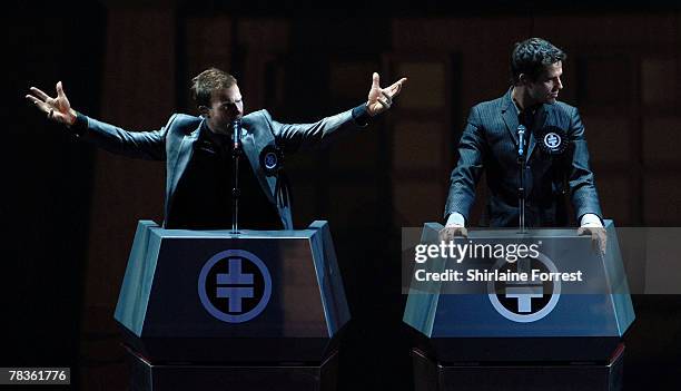 Gary Barlow and Jason Orange of Take That perform at Manchester Arena on December 10, 2007 in Manchester, England.