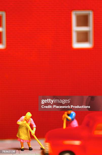 plastic figures sweeping - apron mockup stock pictures, royalty-free photos & images