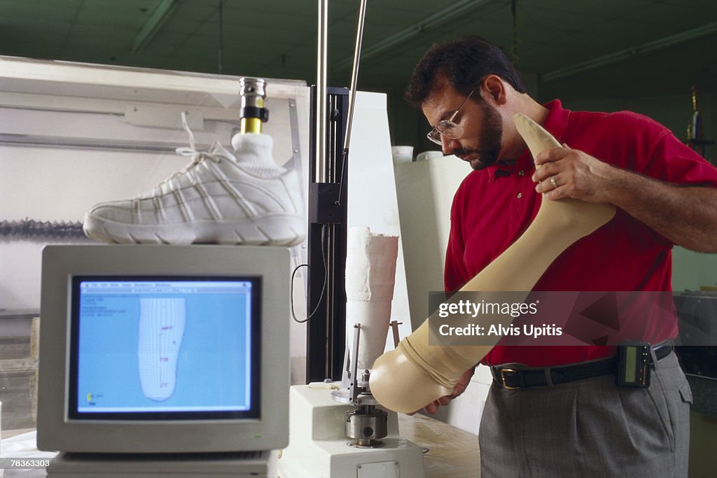 Man designing prosthesis leg