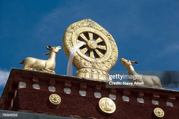 roof detail, jokhang temple, lhasa, tibet autonomous region, china - dharmachakra stock pictures, royalty-free photos & images