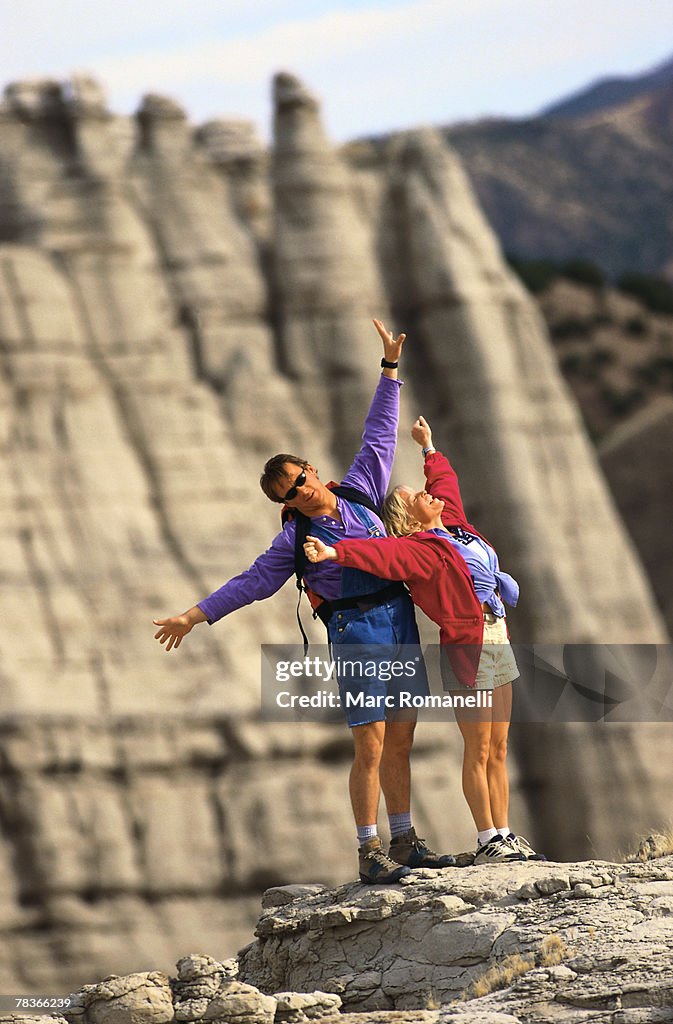 Couple celebrating on mountaintop