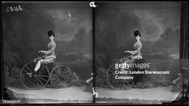 Miss Cornell posed on a velocipede, London, circa 1880.