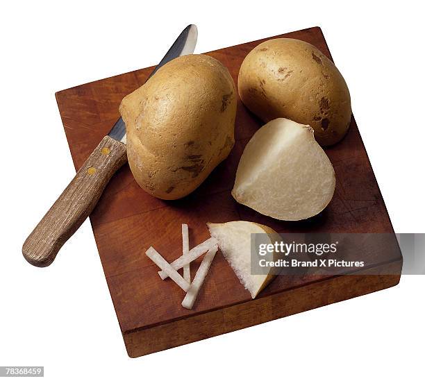 jicama on cutting board - jicama stock pictures, royalty-free photos & images