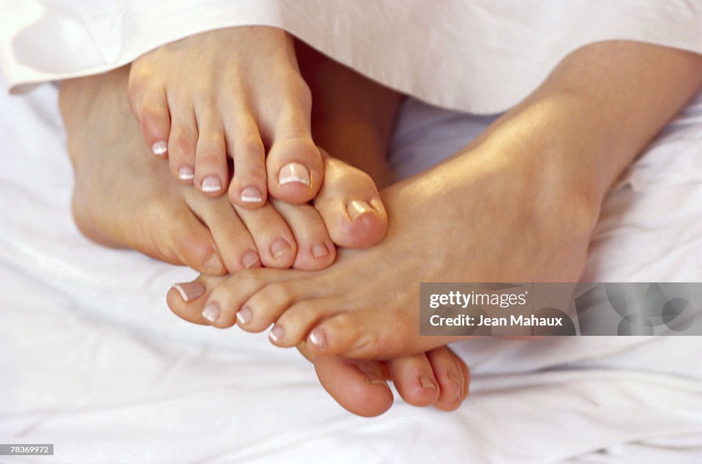 Couple playing footsie