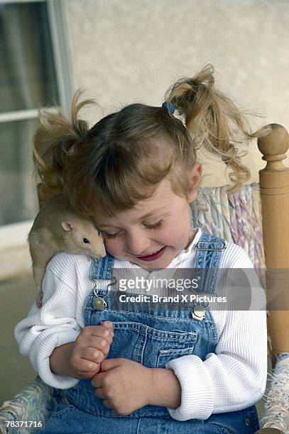 girl with pigtails and rat - animal behavior stock-fotos und bilder