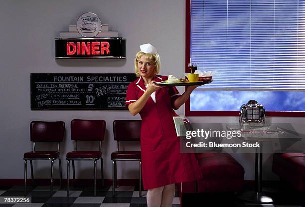 diner waitress with tray of food - waitress booth stock pictures, royalty-free photos & images