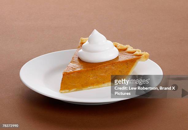 slice of pumpkin pie - pumpkin pie stock pictures, royalty-free photos & images