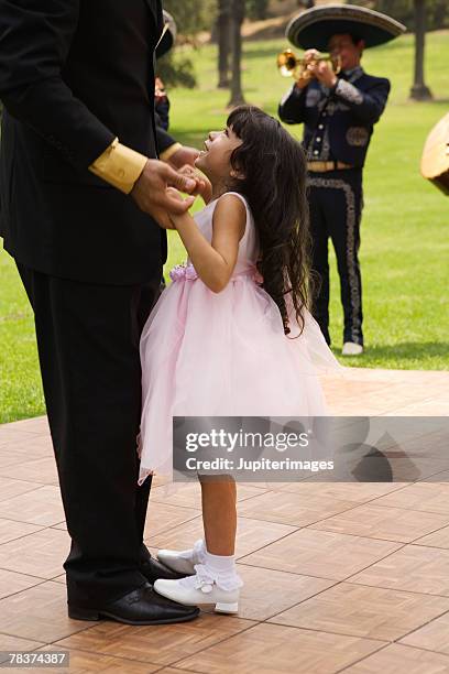 father and girl dancing at quinceanera - wedding feet stock-fotos und bilder