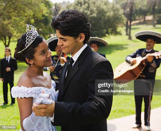 teenage boy and teenage girl dancing at quinceanera - 15th birthday stock pictures, royalty-free photos & images