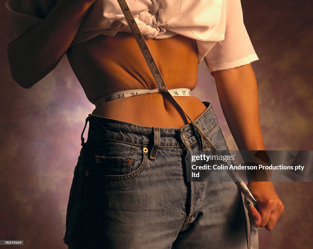 Woman measuring waist