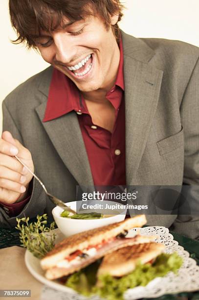 laughing man with soup and sandwich - panorering bildbanksfoton och bilder