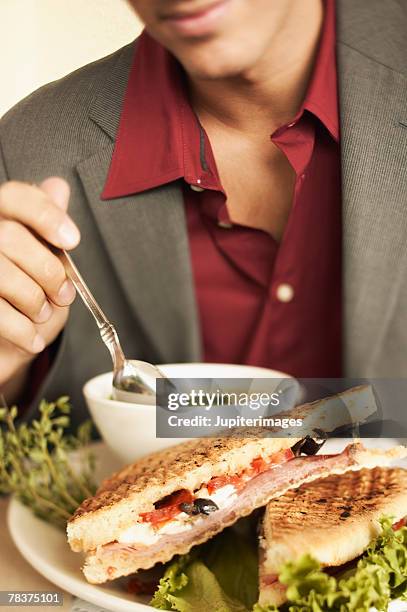 man with soup and sandwich - panorering bildbanksfoton och bilder