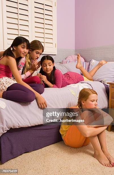 ostracized preteen girl at slumber party - ostracized stock pictures, royalty-free photos & images