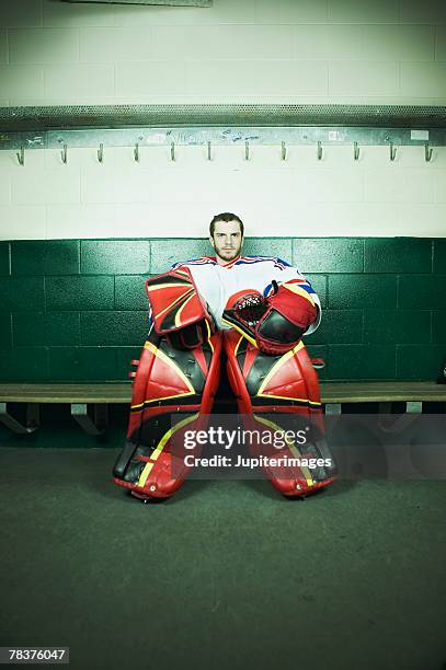 ice hockey goaltender sitting on bench - composition stock pictures, royalty-free photos & images