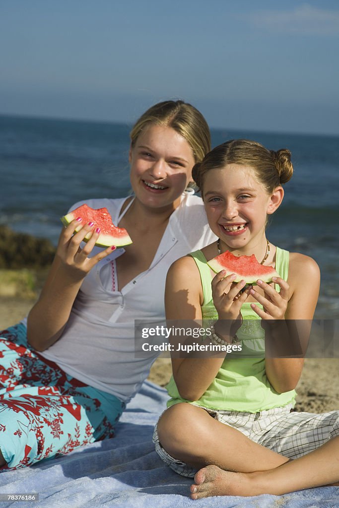 Girls eating watermelon