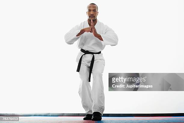 man practicing martial arts - gidräkt bildbanksfoton och bilder
