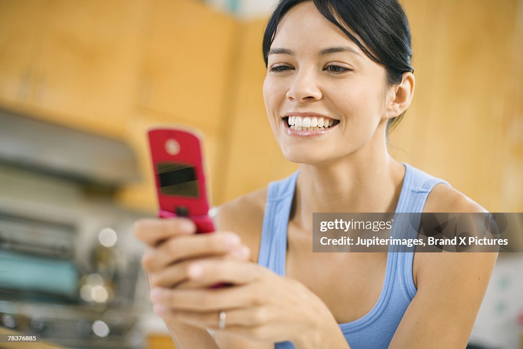 Smiling woman with cell phone