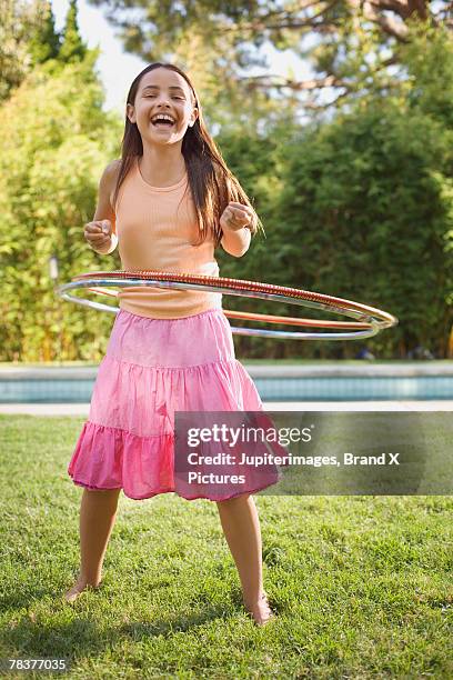 pre-teen girl with plastic hoop toy - 12 year old in skirt stock pictures, royalty-free photos & images