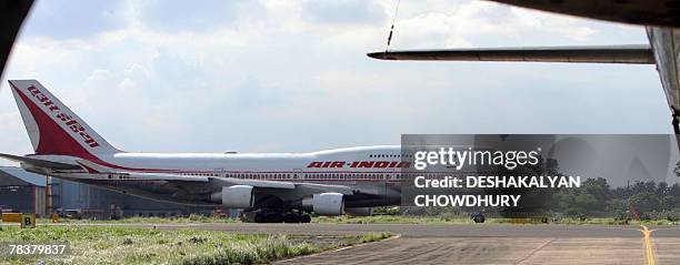In this picture taken 28 September 2007, An Air India aeroplane prepares for takeoff from Netaji Subhash Chandra Bose Airport in Kolkata. India's...