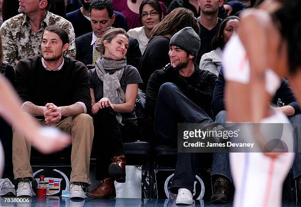 Shane Dreary, Keri Russell and Chace Crawford attend Dallas Mavericks vs New York Knicks game at Madison Square Garden on December 10, 2007 in New...