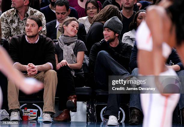 Shane Dreary, Keri Russell and Chace Crawford attend Dallas Mavericks vs New York Knicks game at Madison Square Garden on December 10, 2007 in New...