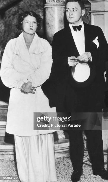 American author F. Scott Fitzgerald attends a formal event with his wife Zelda , circa 1935.