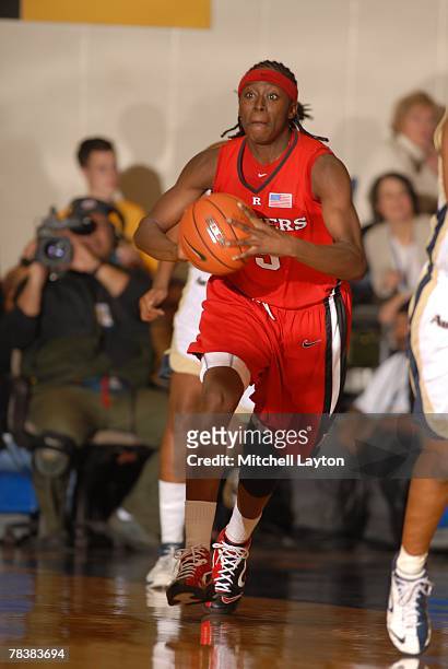 Essenece Carson of the Rutgers Scarlet Knights dribbles the ball up court during a game against the George Washington Colonials at Smith Center on...