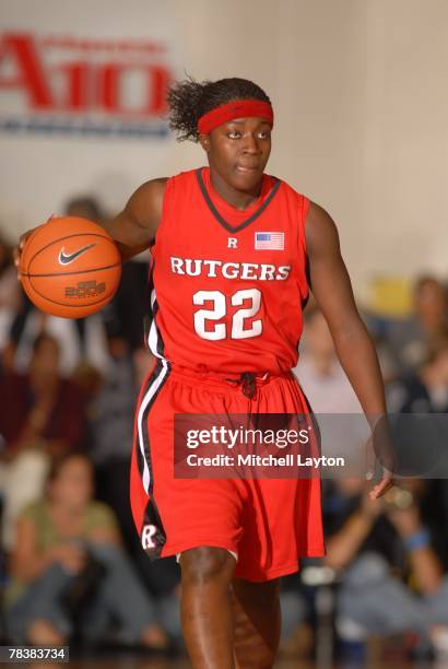Matee Ajavon of the Rutgers Scarlet Knights dribbles the ball up court during a game against the George Washington Colonials at Smith Center on...