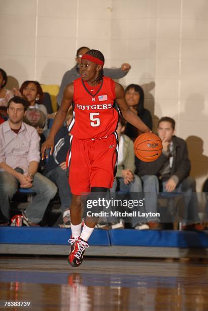 Essenece Carson of the Rutgers Scarlet Knights dribbles the ball up court during a game against the George Washington Colonials at Smith Center on...