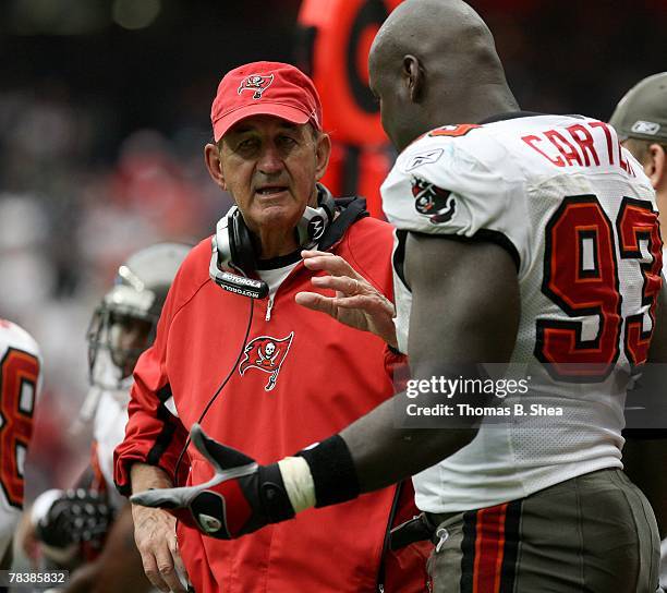 Defensive coordinator Monte Kiffin of the Tampa Bay Buccaneers coaches Kevin Carter during the NFL game against of the Houston Texans at Reliant...