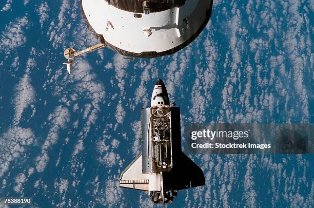 space shuttle atlantis approaches the international space station - apollo space mission stock pictures, royalty-free photos & images