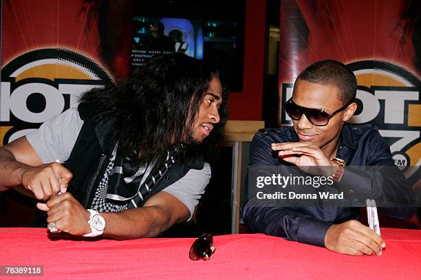 Singer Omarion and rapper Bow Wow pose while signing their new CD "FACE OFF" at Circuit City on December 11, 2007 in New York City, New York.