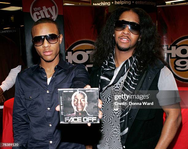 Rapper Bow Wow and singer Omarion pose before signing their new CD "FACE OFF" at Circuit City on December 11, 2007 in New York City.