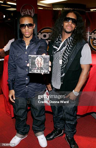 Rapper Bow Wow and singer Omarion pose before signing their new CD "FACE OFF" at Circuit City on December 11, 2007 in New York City.