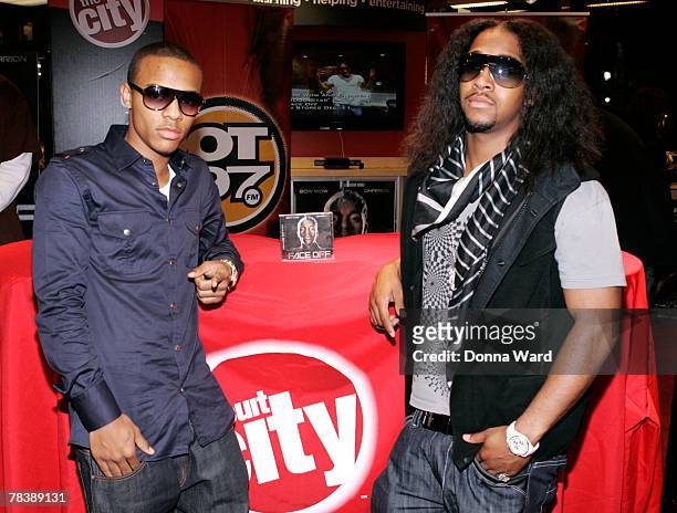 Rapper Bow Wow and singer Omarion pose before signing their new CD "FACE OFF" at Circuit City on December 11, 2007 in New York City.