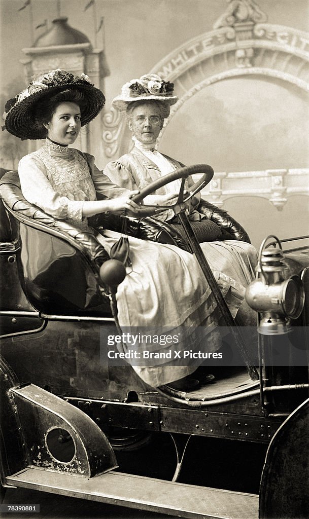 Victorian women in old car