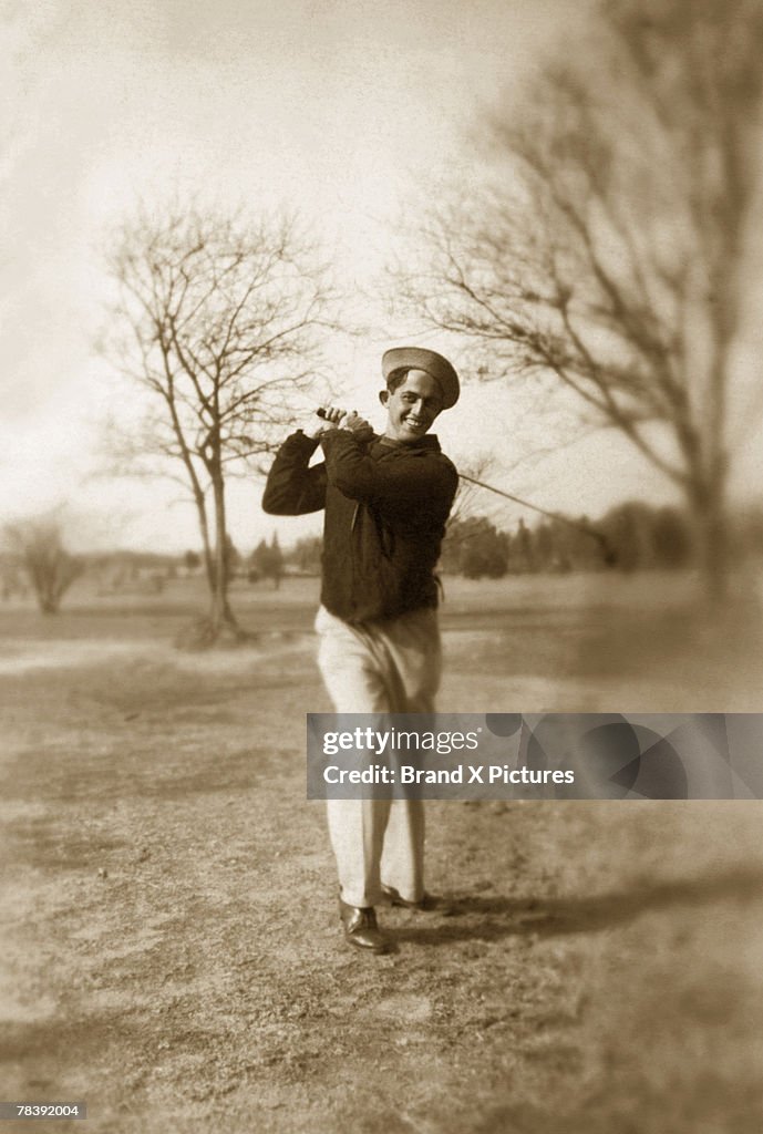 Vintage man playing golf