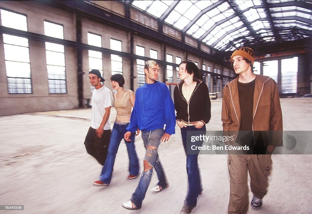 Friends walking through train station