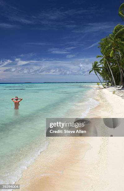 woman swimming in tropics - women skinny dipping stockfoto's en -beelden